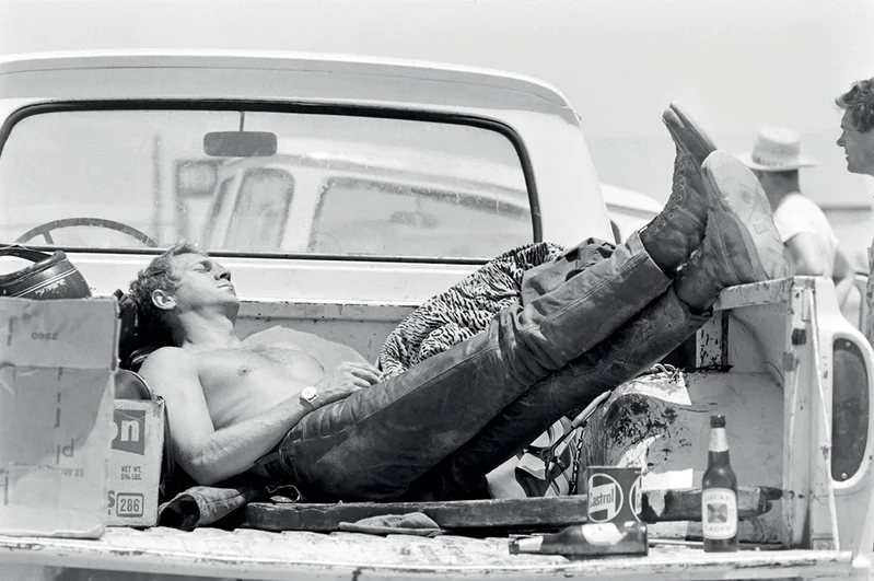 Man sleeping in a pickup truck bed